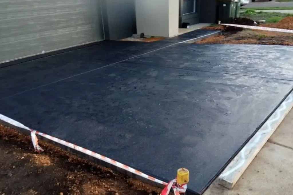 charcoal coloured concrete driveway